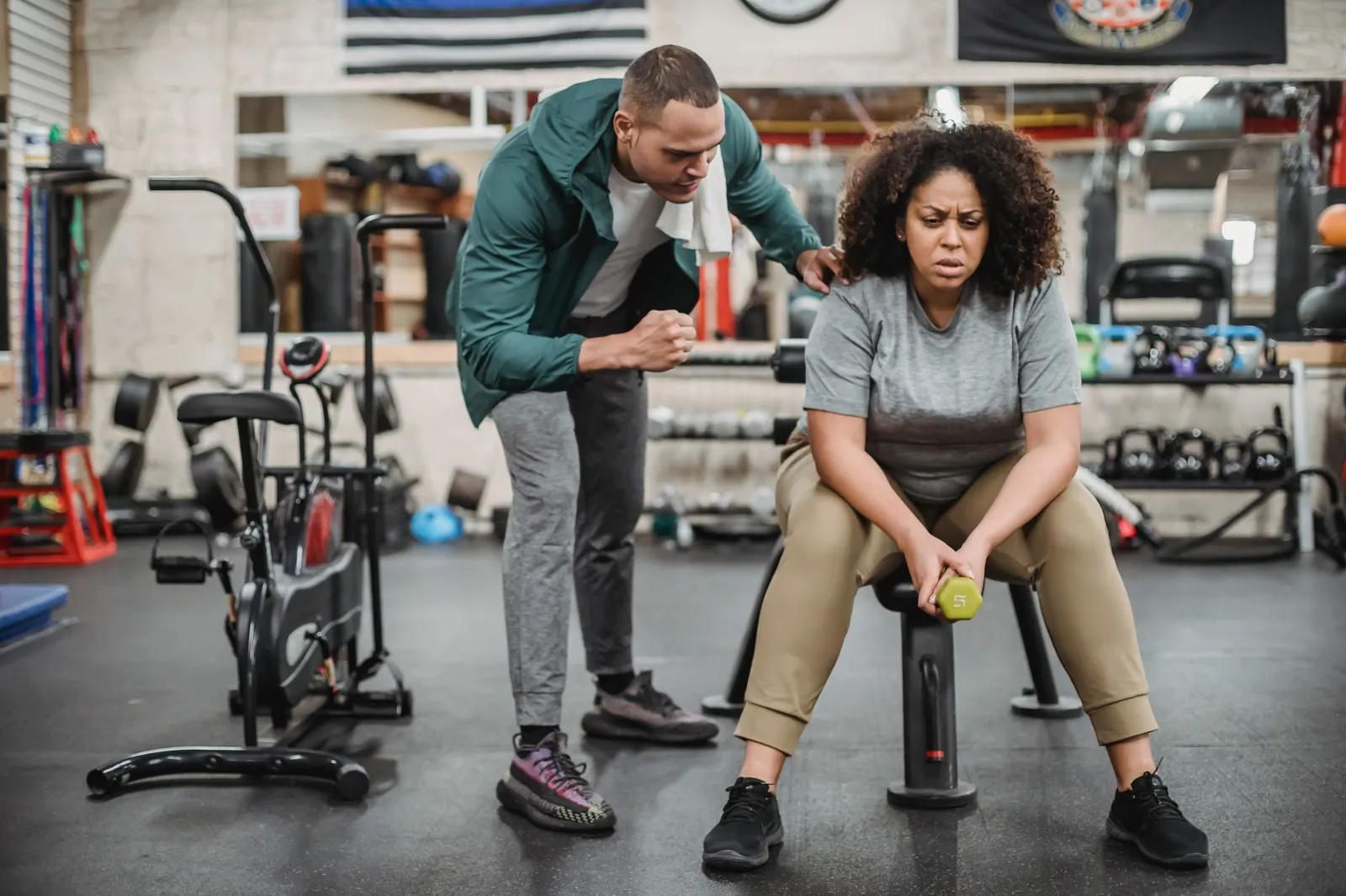 A fitness coach reviewing a client programme