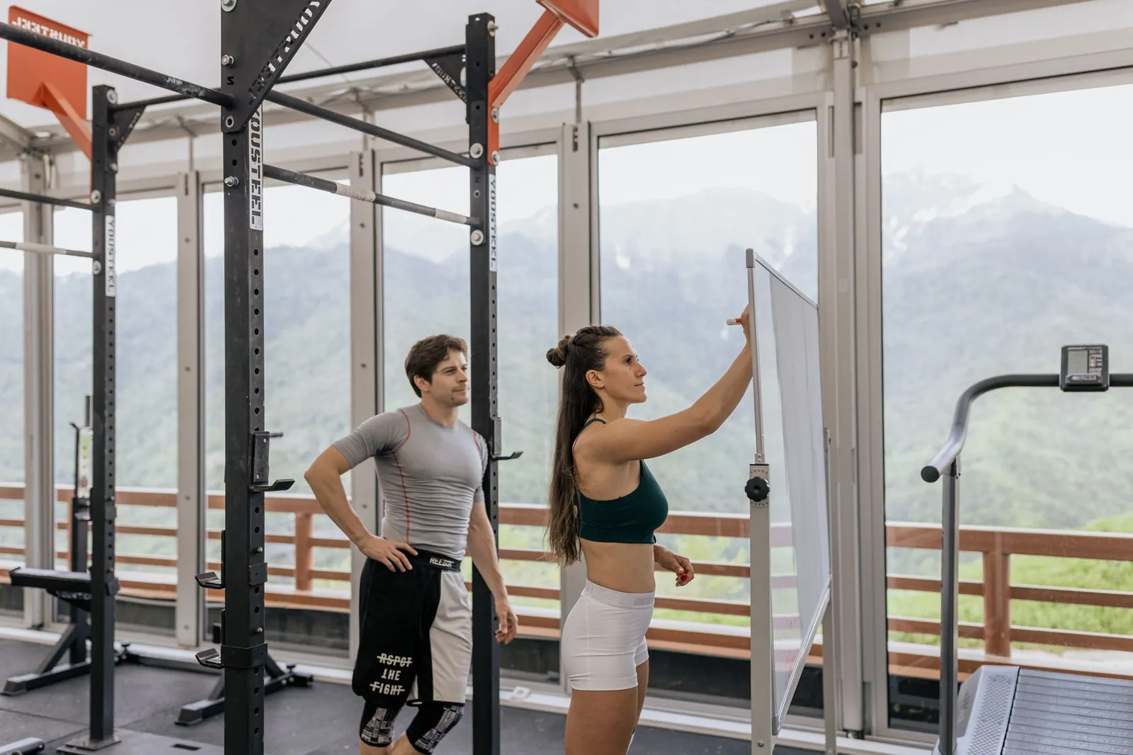 A health coach reviewing client progress
